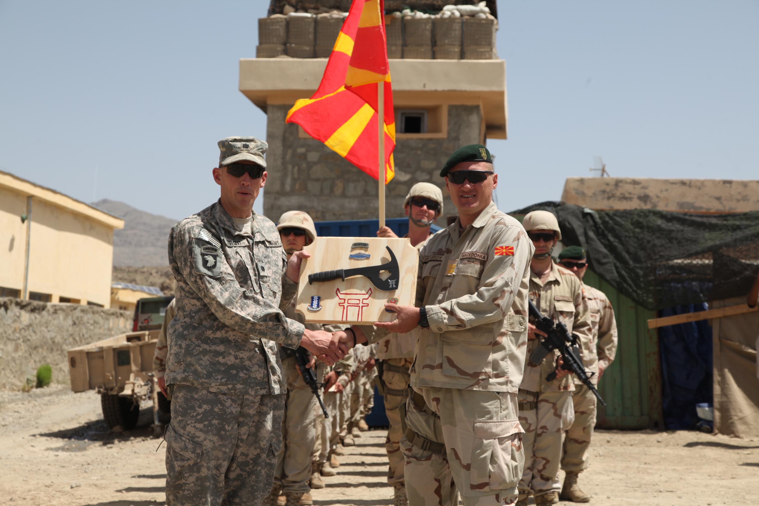 Afghanistan - U.S. Army Lt. Col. David Fivecoat, 3rd Battalion, 187th Infantry Regiment Commander, from Delaware, Ohio, presents Macedonian Capt. Borche Turturov